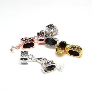 Kappelverschluss oval gepunktet 43x15mm innen: 7x12mm per Set
