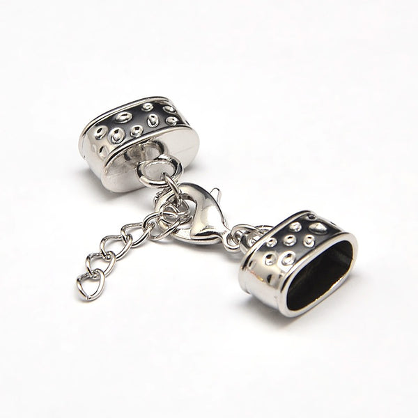 Kappelverschluss oval gepunktet 43x15mm innen: 7x12mm per Set