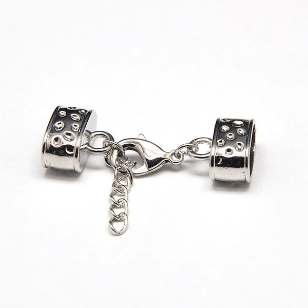 Kappelverschluss oval gepunktet 43x15mm innen: 7x12mm per Set