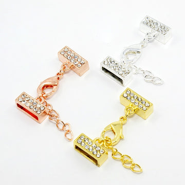 Kappelverschluss rechteckig / Strass 32x13mm innen 11x2mm per Set