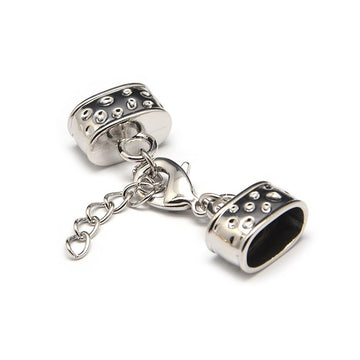Kappelverschluss oval gepunktet 43x15mm innen: 7x12mm per Set