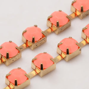 Strass-Kette Korallenopal, goldfärbig 6x5mm, pro Laufmeter