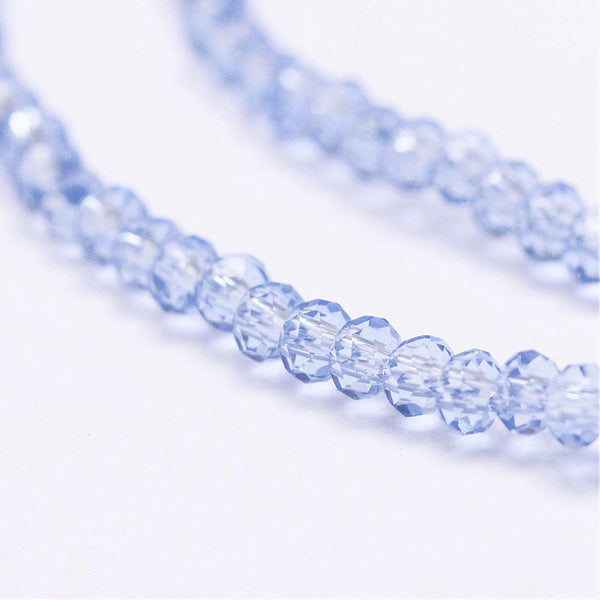 Glasschliffperlen Rondelle facettiert Cornflower Blue transparent 2,5x1,5mm 152 Stück / Strang