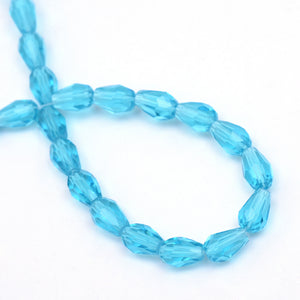 Glasperlen Tropfen facettiert transparent Deep Sky Blue 11x8mm 60 Stück / Strang
